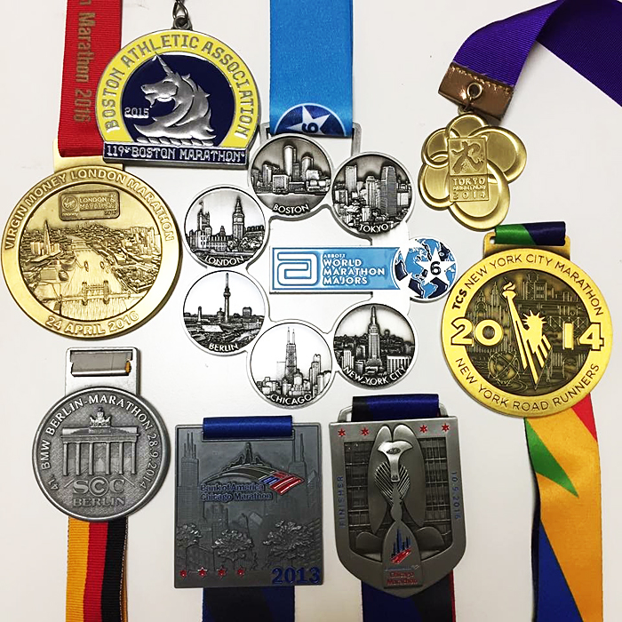Six Star達成後にもらえる特別な6-starメダル（中央）と各大会の完走メダル